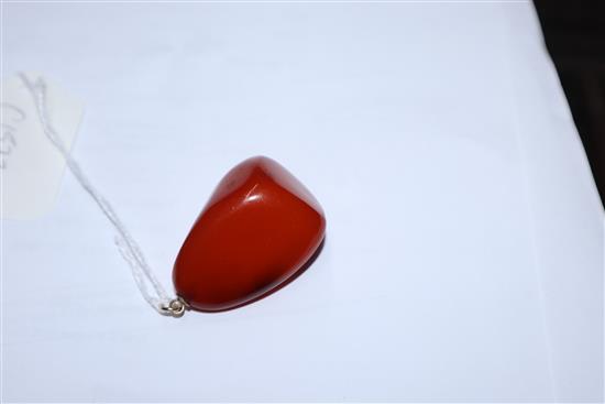 A yellow metal mounted natural amber pebble pendant, with GCS certificate dated 8/5/19.